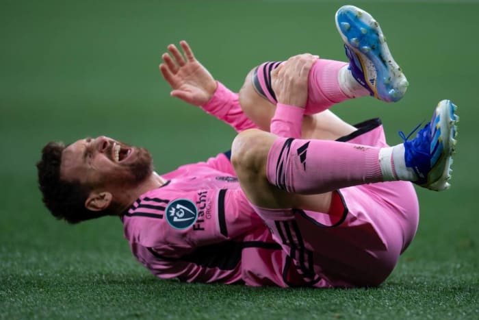 Lionel Messi pictured holding his left shin during Inter Miami's 2-2 draw at Nashville in March 2024